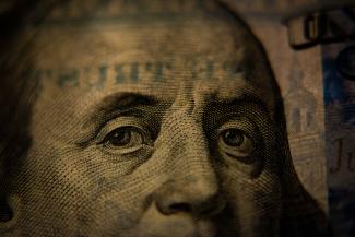 a close up of a one dollar bill by Adam Nir courtesy of Unsplash.